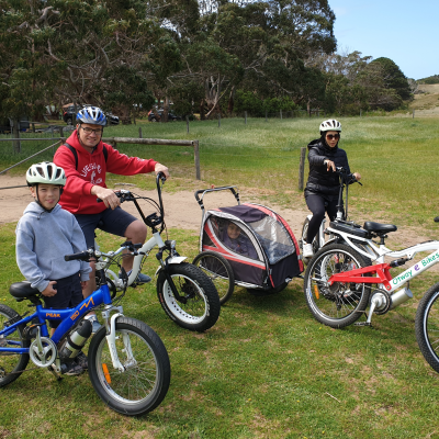 3 kids riding e bike