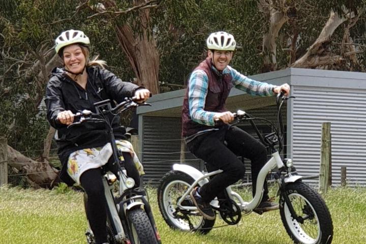 2 people paddling on e bikes